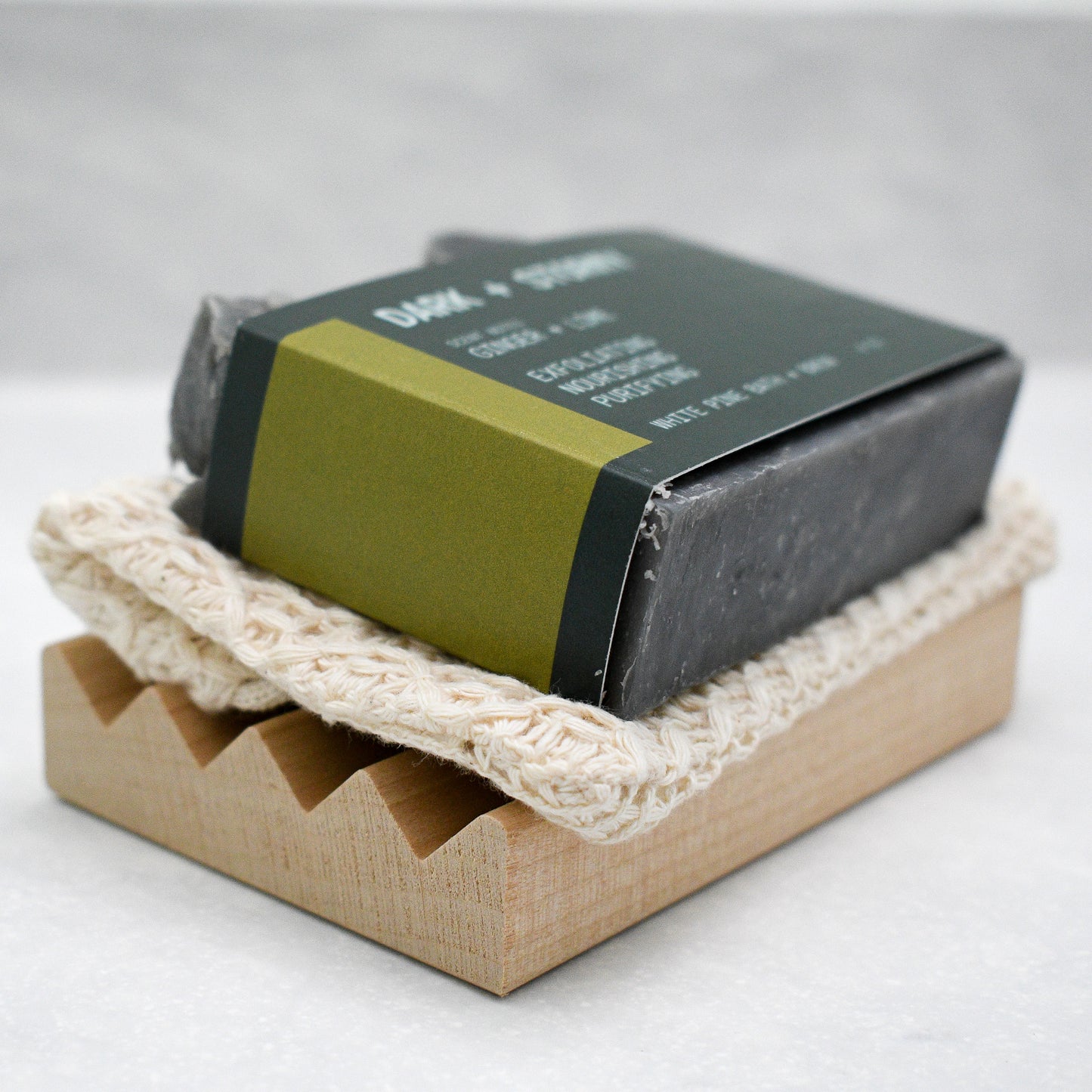 Dark + Stormy beer soap set including bar of soap, soap saver bag, and wooden soap dish