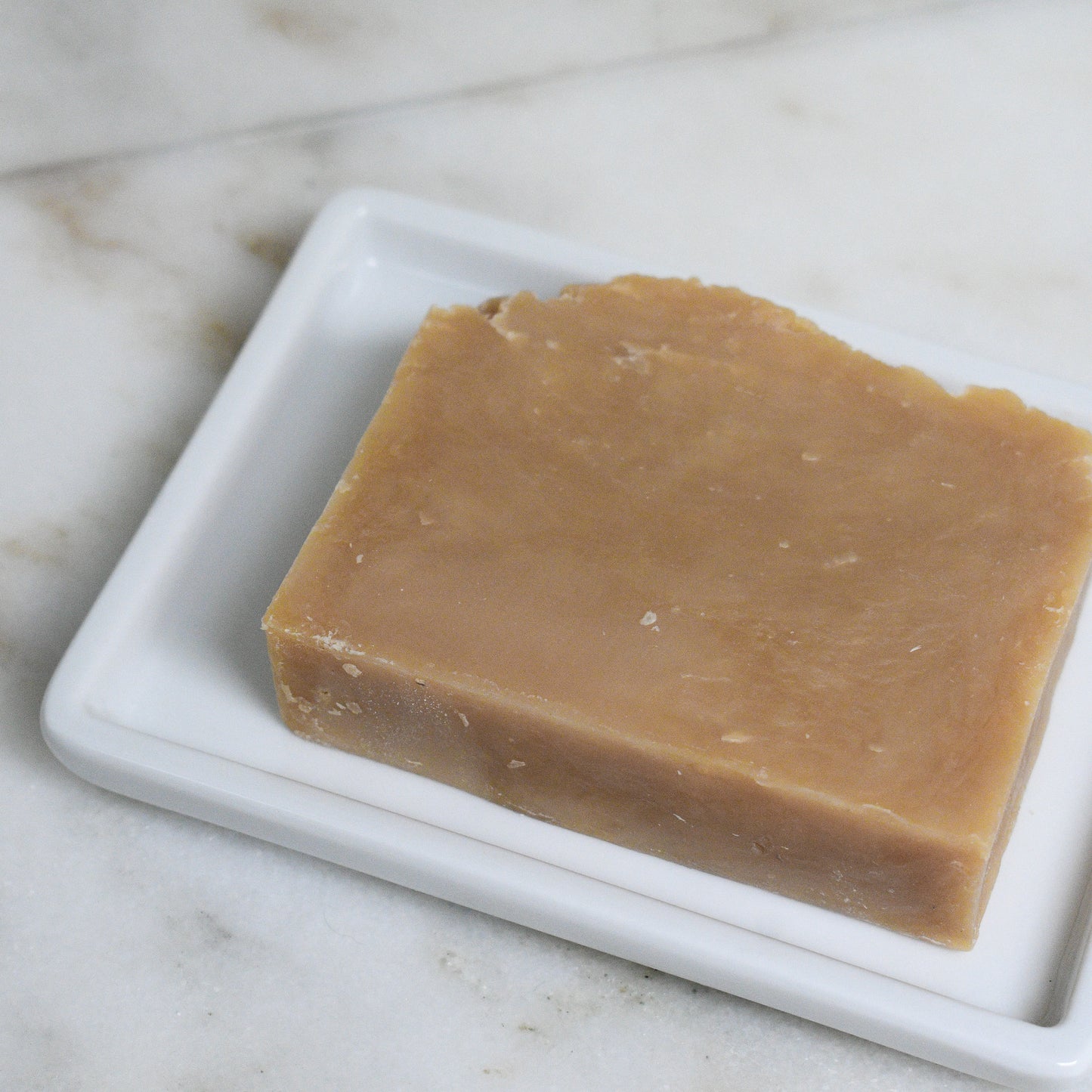 bar of maine woodsman beer soap scented with citrus and pine