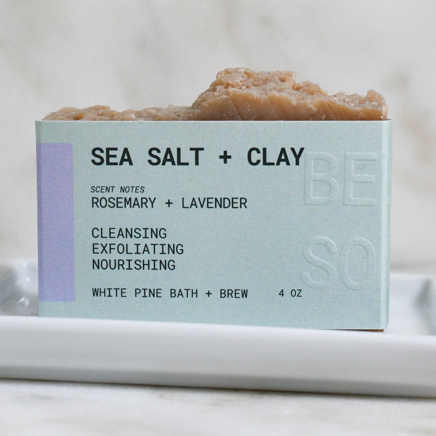 Sea Salt + Clay beer soap scented with rosemary and lavender, stating it is cleansing, exfoliating, and nourishing