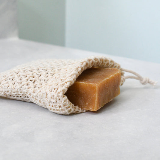 bar of lemongrass shea and ipa beer soap in soap saver bag