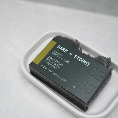 bar of dark and stormy beer soap in ceramic dish