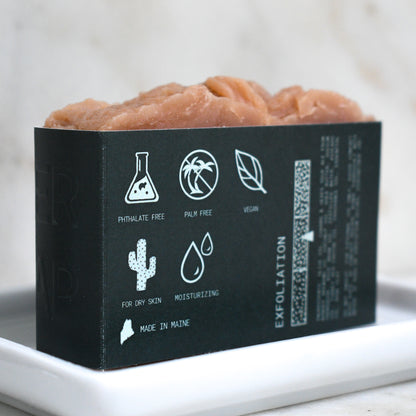 Kettle Rose beer soap on a ceramic soap dish showing on the back label that it is Phthalate free, palm free, vegan, for dry skin, moisturizing, and made in Maine