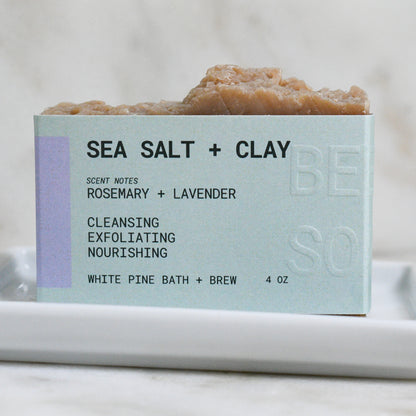 Sea Salt + Clay beer soap scented with rosemary and lavender, stating it is cleansing, exfoliating, and nourishing