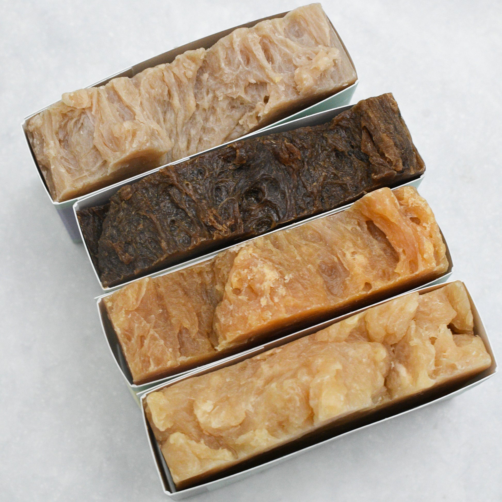 four bars of beer soap: sea salt + clay, coffee brew bar, lemongrass shea + IPA, and Maine Woodsman