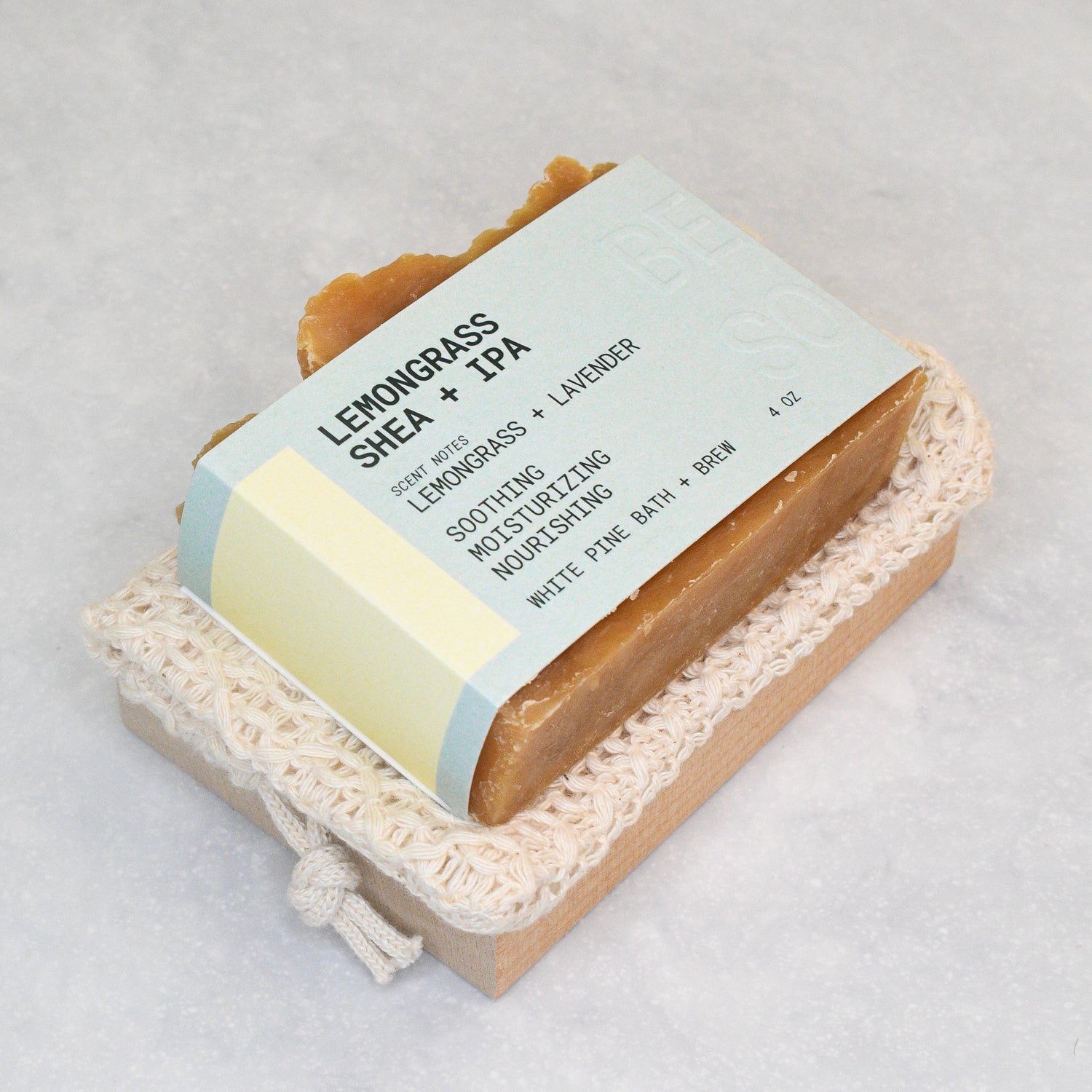 lemongrass shea + IPA, organic cotton soap saver bag, and wooden soap dish